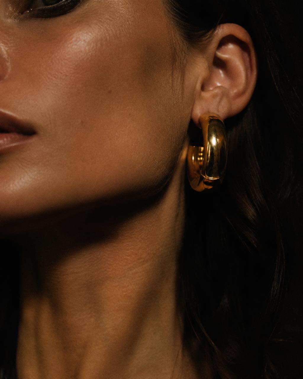 Close-up of a gold hoop earring